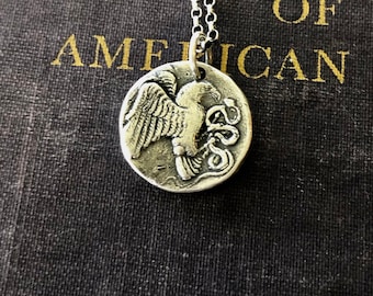 Eagle and Snake. Sterling silver  Antique Greek coin replica. Represents a huge struggle.