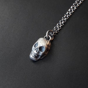 Tiny solid silver skull. Memento mori, add to your amulet. Small add on....