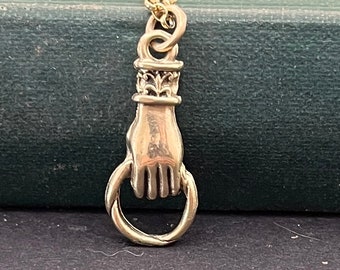 9 carat yellow gold hand holder. Solid gold (not plated)