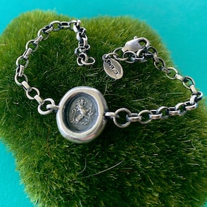 Sterling silver &#39;Valiant&#39; lion bracelet. Antique wax letter seal impression