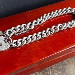 Solid sterling silver curb chain bracelet . With padlock and safety chain. 7.25mm links.  Made to order in your size.