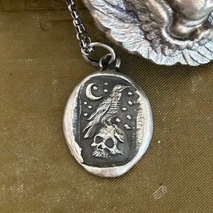 sterling silver, Raven and skull pendant with Moon and stars.