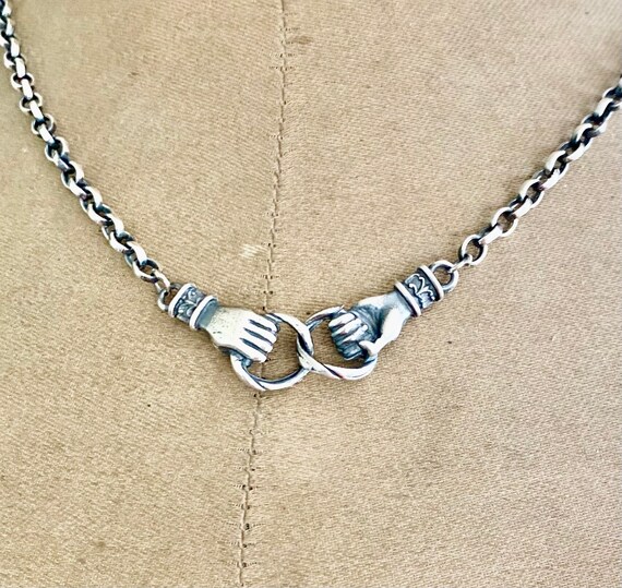Clasped Hands Necklace. Sterling Silver 