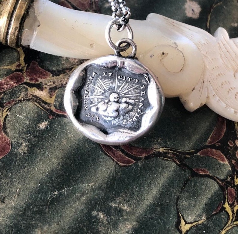 Storms pass and hard times don't last forever..... handmade, sterling, antique wax seal necklace.