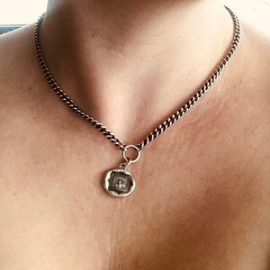 Storms pass and hard times don't last forever..... handmade, sterling, antique wax seal necklace.