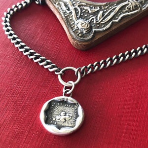 Storms pass and hard times don't last forever..... handmade, sterling, antique wax seal necklace.