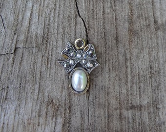 Simulated Pearl Pendant Little Charm Silvertone And Gold Tone Oval With Shaped Bow Cover With Chrome Plated Rhinestones