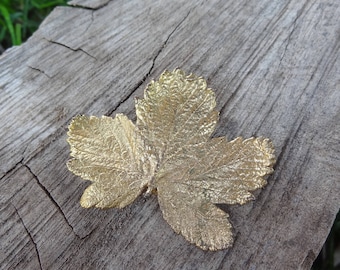 Gold tone autumn leaf