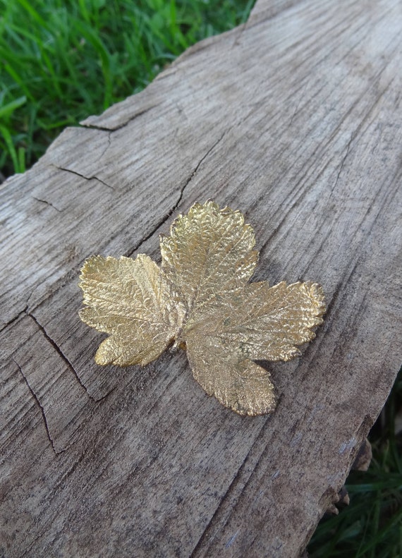 Gold tone autumn leaf