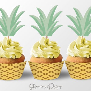 May include: Three yellow cupcakes with green pineapple cupcake toppers. The cupcakes are decorated with yellow frosting and have a yellow and brown pineapple patterned cupcake liner.