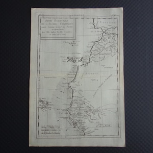 Puede incluir: Un mapa antiguo con texto en francés, con líneas geográficas detalladas y nombres de lugares. El mapa está impreso en tinta negra sobre papel envejecido, mostrando una estética vintage. El título dice "Partie Occidentale du L'Ancien Continent".