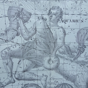 May include: A black and white celestial map illustration featuring the Aquarius constellation. The artwork depicts a figure pouring water from a vessel, surrounded by a grid of stars and lines, with the text Aquarius clearly visible in the center.