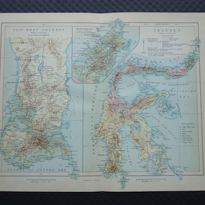 Pode incluir: Um mapa antigo de Celebes, com informações geográficas detalhadas. O mapa é impresso em papel envelhecido, com texto em inglês e outros idiomas. O mapa mostra as ilhas com várias cores e etiquetas.