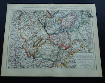 May include: A vintage map print featuring the regions of Rijnprovincie, Westfalen, Hessen-Nassau, and Groothertogdom Hessen. The map is detailed with colored borders and text, printed on aged paper. The map is on a black background.