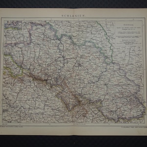 May include: Antique map of Schlesien, featuring detailed geographical information. The map is printed on aged paper, with intricate lines representing roads, rivers, and towns. The title "SCHLESIEN" is printed at the top. The map is a historical document.
