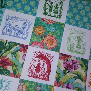 May include: A patchwork quilt with a variety of floral and nature-themed embroidered designs. The quilt is made up of nine squares, each with a different design. The designs include a couple holding hands, a girl with a bird, a girl with a basket, and a tree with a bird.