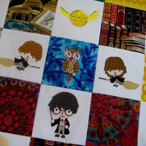 May include: A colorful quilt with a patchwork design featuring various Harry Potter characters and symbols. The quilt includes an owl, a broom, a wizard, and a book. The quilt is made of different fabrics and colors, including blue, green, red, yellow, and white.