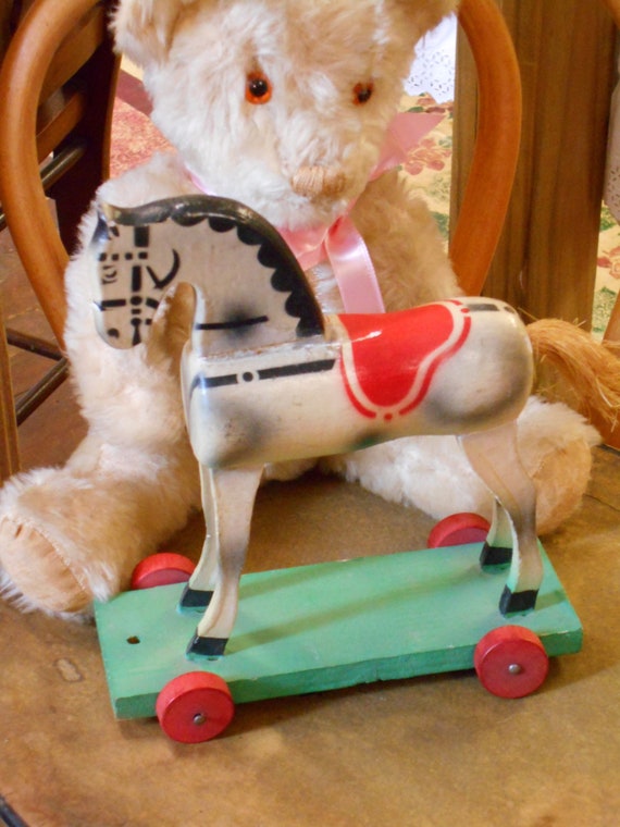 vintage toy horse on wheels
