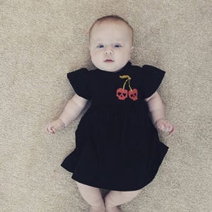 Black cherry skull printed baby dress image 3