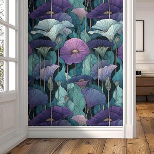 May include: A floral wallpaper design featuring stylized purple, blue, and teal flowers and leaves. The wallpaper is installed on a wall in a room with a wooden floor and a partially open door.