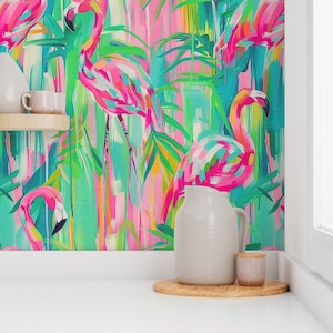 May include: A colorful wallpaper featuring pink flamingos and tropical leaves on a bright green, blue, and pink background.
