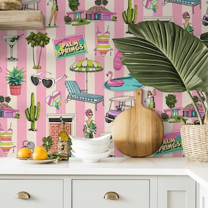 May include: A whimsical wallpaper design featuring pink and white stripes with retro Palm Springs-themed illustrations. The pattern includes images of houses, swimsuits, sunglasses, and golf carts, creating a vintage vacation vibe.