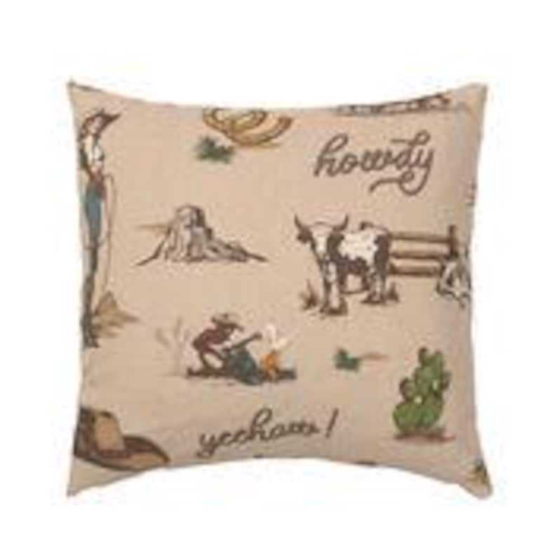 May include: Beige throw pillow with a brown and white cowboy themed pattern. The pattern includes cowboys, horses, cacti, and the words "howdy" and "y'all".
