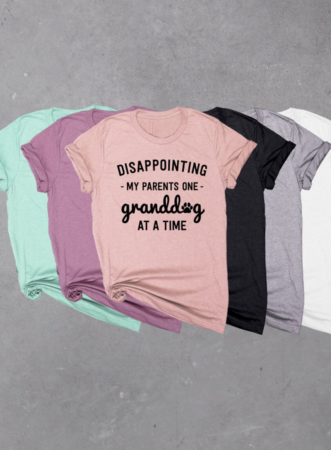 Graphic T-Shirt with the words "Disappointing My Parents One Granddog At A Time".