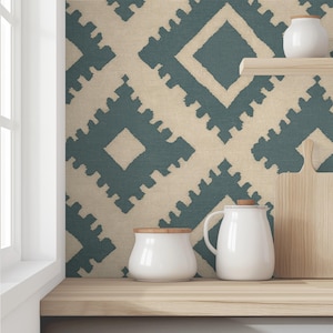 May include: A kitchen scene featuring a light wood shelf with white ceramic containers and a cutting board. The background is a patterned wallpaper in teal and beige. The scene is lit by natural light from a nearby window.