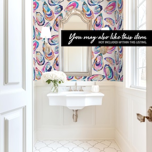 May include: A bright, modern bathroom with a white sink, mirror, and patterned wallpaper. The wallpaper features colorful oyster shell designs in shades of pink, blue, and yellow. The text "You may also like this item" is displayed on a black banner.