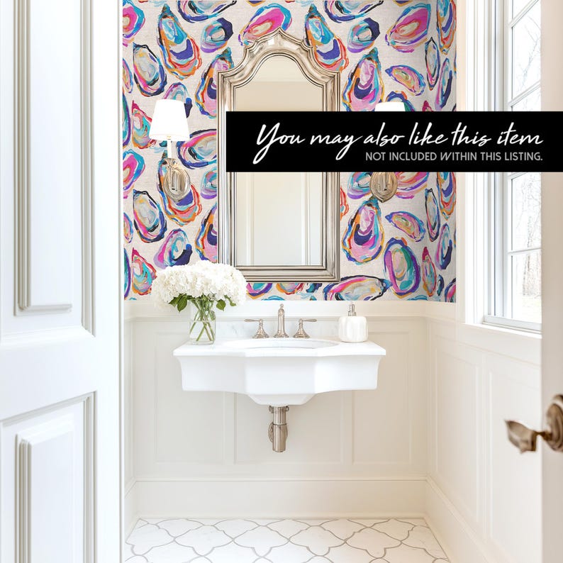 May include: A bright, modern bathroom with a white sink, mirror, and patterned wallpaper. The wallpaper features colorful oyster shell designs in shades of pink, blue, and yellow. The text "You may also like this item" is displayed on a black banner.