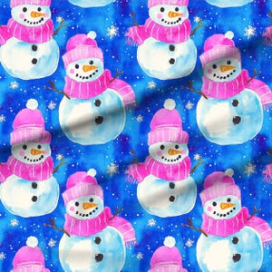 May include: Watercolor pattern featuring multiple snowmen on a blue background with white snowflakes. Each snowman has a pink hat, scarf, and twig arms. The snowmen have black button eyes and a carrot nose.