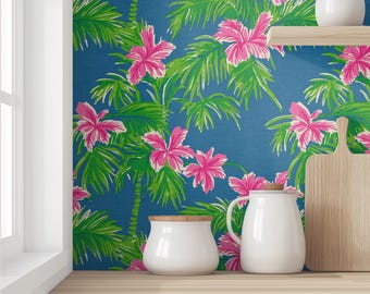 May include: A blue and green tropical wallpaper with pink flowers. The wallpaper is shown in a kitchen setting with white ceramic containers and a wooden cutting board.