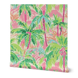 a pink and green wallpaper with palm trees