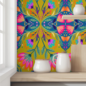 May include: A vibrant floral wallpaper design in teal, pink, and gold. The image features a wooden shelf with white ceramic jars, a cutting board, and a small vase. The wallpaper has a symmetrical pattern of stylized flowers.
