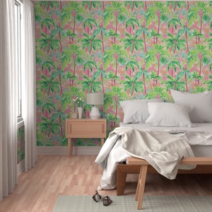a bedroom with a palm tree wallpaper and a bed