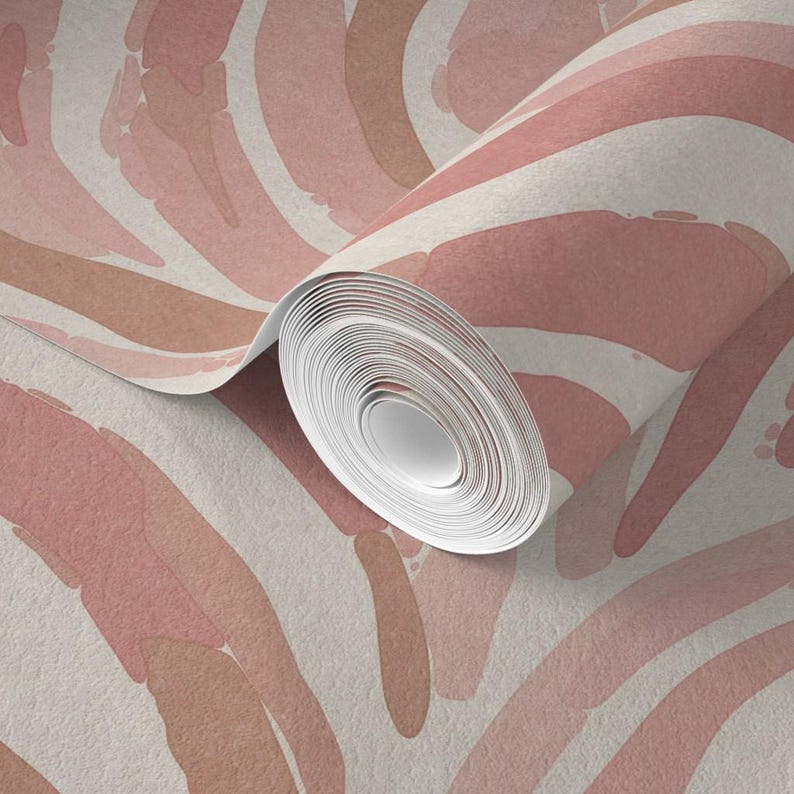 May include: A roll of wallpaper with a pink and brown abstract pattern. The wallpaper has a watercolor-like effect and features a repeating pattern of curved lines.