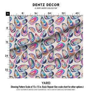May include: Fabric yardage with a repeating pattern of colorful oyster shell illustrations in shades of blue, pink, and yellow on a cream background. The text "DENTZ D&Eacute;COR" and "A HOME GOODS COLLECTION" are at the top. The pattern scale is 15 x 15 inches.