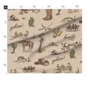 May include: A beige fabric with a repeating pattern of cowboy-themed illustrations. The pattern includes cowboys, horses, cacti, horseshoes, and the words "yechaw!" and "howdy".