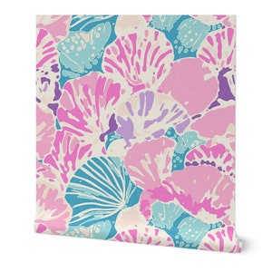 May include: A seamless pattern featuring pink, blue, and purple stylized seashells on a cream background.