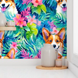 May include: A colorful wallpaper featuring a repeating pattern of cartoon corgis and tropical flowers and leaves. The wallpaper is displayed on a white wall in a kitchen setting.