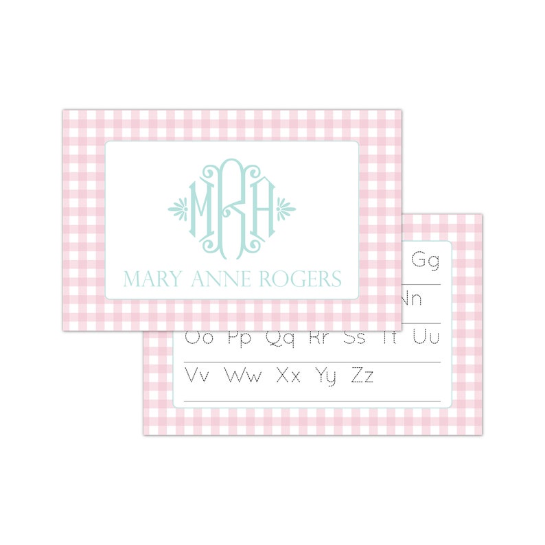 May include: Pink and white gingham card with a monogram of the letters "MRA" in light blue. The text "MARY ANNE ROGERS" is printed below the monogram. The second card is also pink and white gingham and has a dotted line for tracing the letters of the alphabet.