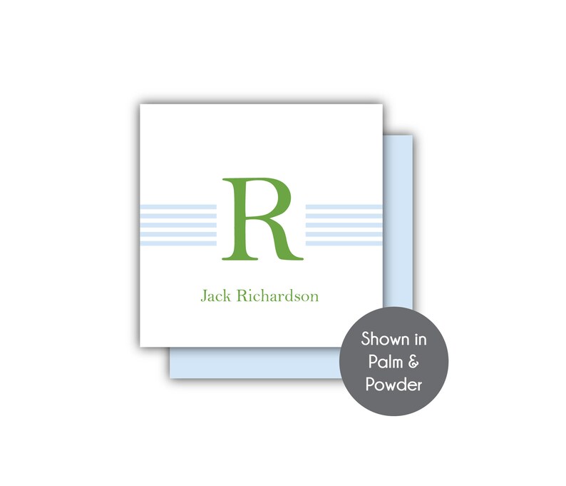 May include: A white card with a green letter "R" and blue stripes. The text "Jack Richardson" is printed below the letter. The card is shown in Palm & Powder.