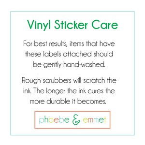 May include: A green and white square with the text "Vinyl Sticker Care" in green. The text below explains how to care for vinyl stickers. The text reads: "For best results, items that have these labels attached should be gently hand-washed. Rough scrubbers will scratch the ink. The longer the ink cures the more durable it becomes." The text "phoebe & emmet" is in a peach-colored rectangle at the bottom.