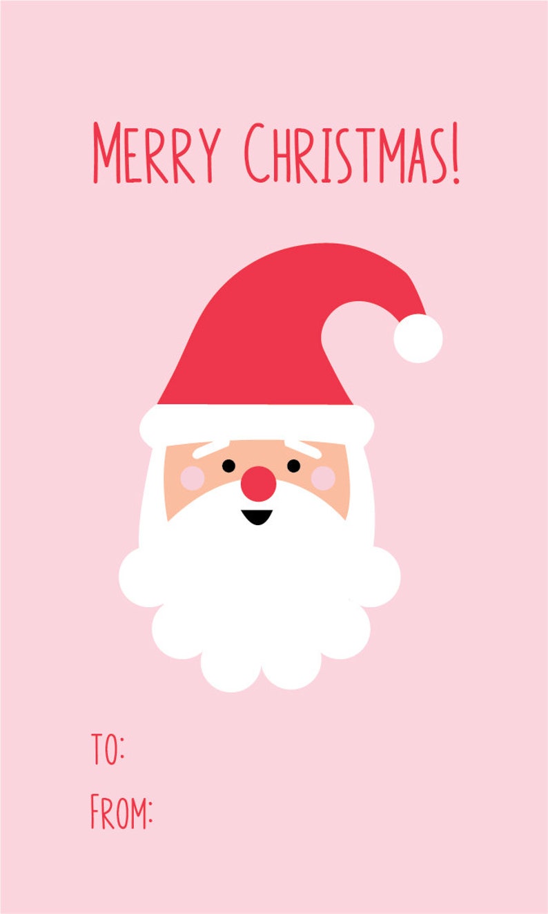 May include: A pink Christmas card featuring a cartoon Santa Claus with a red hat and white beard. The text "MERRY CHRISTMAS!" is at the top, with spaces for "TO:" and "FROM:" at the bottom.