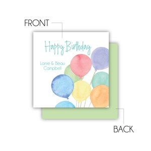 May include: Happy Birthday card with a watercolor illustration of colorful balloons. The card is white with blue text that says "Happy Birthday" and "Lanie & Beau Campbell".