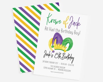 May include: A white invitation with green, purple, and yellow watercolor illustrations of a jester's hat. The text reads "Krewe of Jack, All Hail the Birthday Boy! Jack's 5th Birthday, Saturday, February 21st, 10:00 AM - 12:00 PM, The Children's Museum, 15789 Highway 39, Meridian, Mississippi, RSVP to [number]"