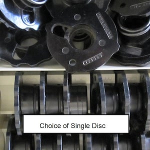 May include: A close-up of a pile of black metal discs with a label that reads "Choice of Single Disc".