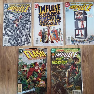 May include: A set of three ceramic mugs with a speckled, matte finish. Each mug features a different color: light blue, cream, and gray. The mugs have a simple, modern design and a comfortable handle.