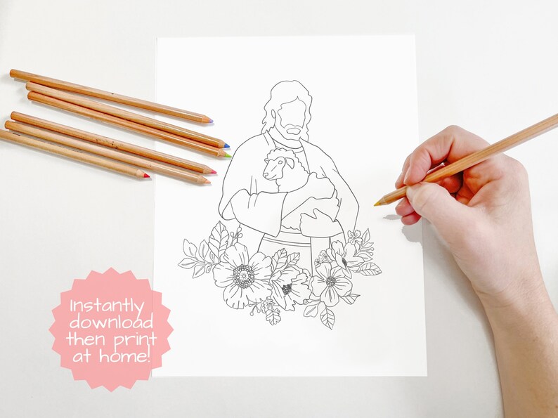 May include: A black and white line drawing of Jesus holding a lamb. The drawing is surrounded by flowers. The image is on a white background. The text "Instantly download then print at home!" is in a pink starburst shape in the bottom left corner.